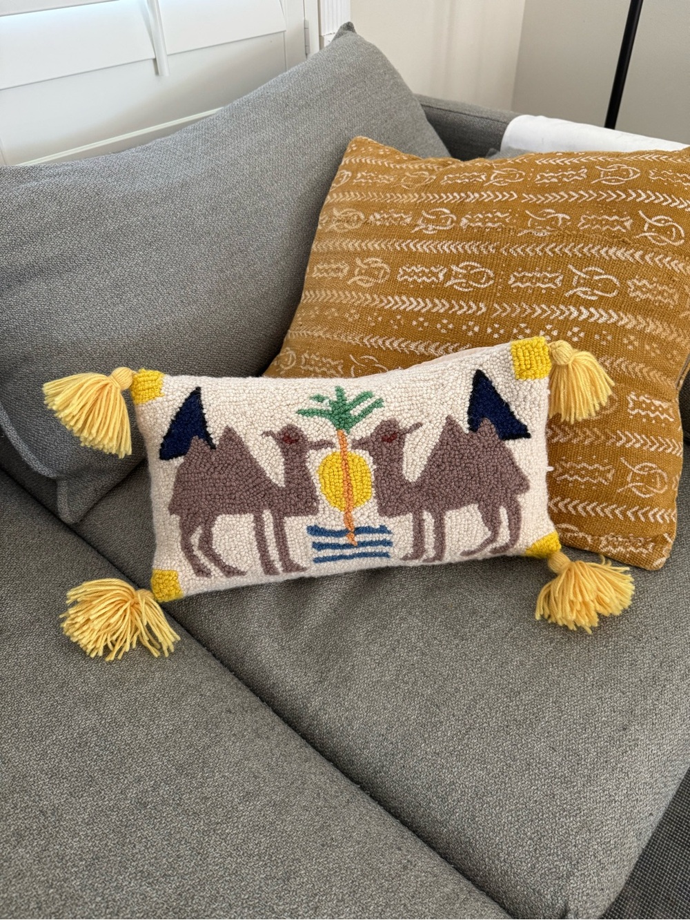 Camel Motif Tassel Accent Pillow in Yellow and Cream
